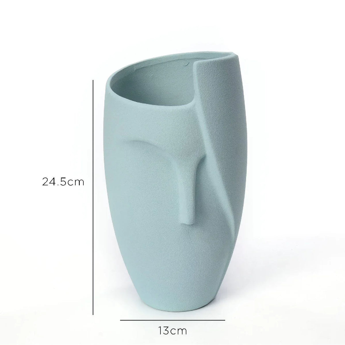 Close-up of white ceramic face planter showing detailed facial features, clean and smooth finish.