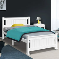 White single pine wood bed frame corner showing reinforced angled bracket.