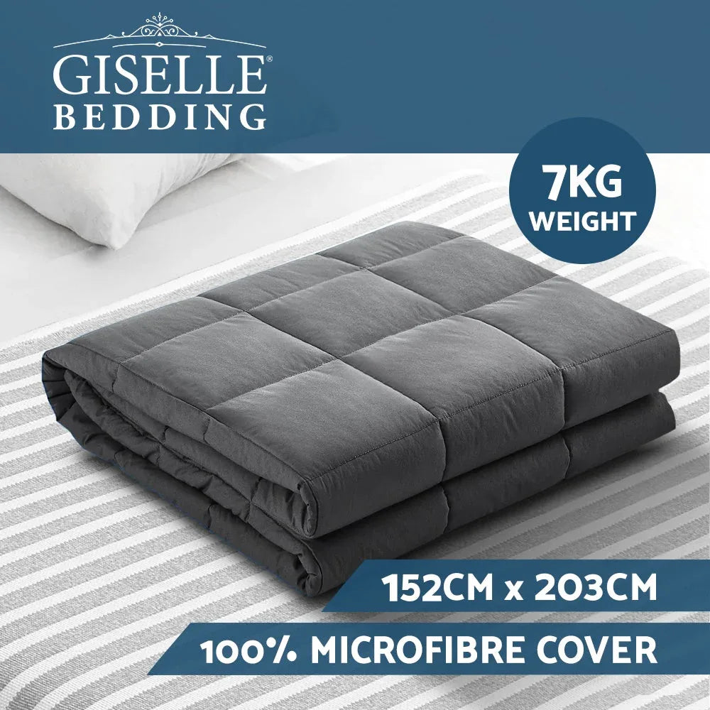 7KG weighted blanket spread over a bed showing textured fabric surface.