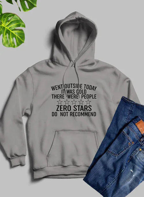 Front view of a person wearing a black hoodie with white 'Went Outside Today' text design.