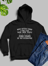 Close-up photo of a white hoodie with 'Went Outside Today' black text artwork on front.