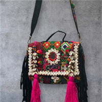 Banjara Boho Sling Bag full view showing intricate hand-embroidered multicolor patchwork and pom-poms.
