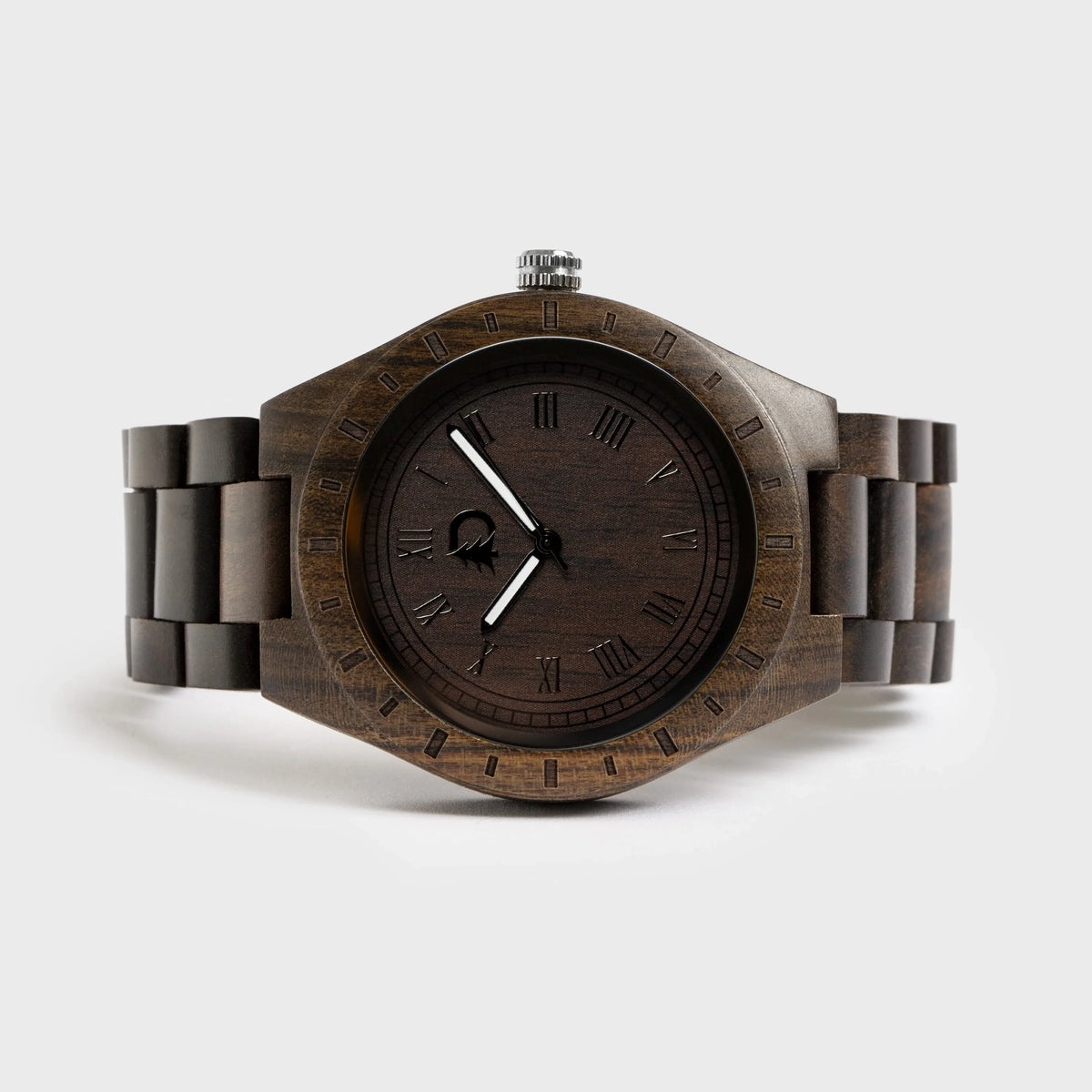 Close-up of men's stylish wood watch featuring black walnut wood face with silver hands and hour markers.