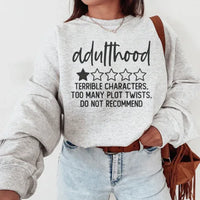 Sport grey sweatshirt with colorful text design stating 'Adulthood Terrible Characters Too Many Plot Twists'