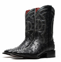 Side view of premium black ostrich skin cowboy boot highlighting red leather interior.
