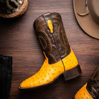 Side view of Alabama Buttercup cowboy boot showing red leather interior lining.