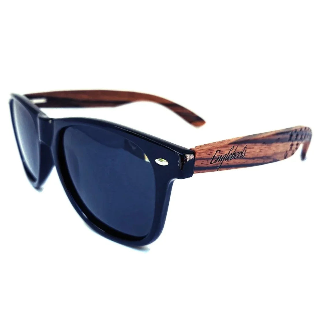 Close-up corner view of Zebrawood sunglasses highlighting engraved wooden frame detail.