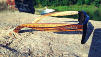 Side angle of Zebrawood sunglasses emphasizing natural wood grain and shape
