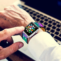 The Lumination Holographic Apple Watch Band attached to an Apple Watch displaying a glowing, holographic effect.