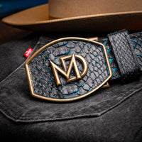 Model wearing Arkansas genuine python skin belt with Western style buckle in casual setting