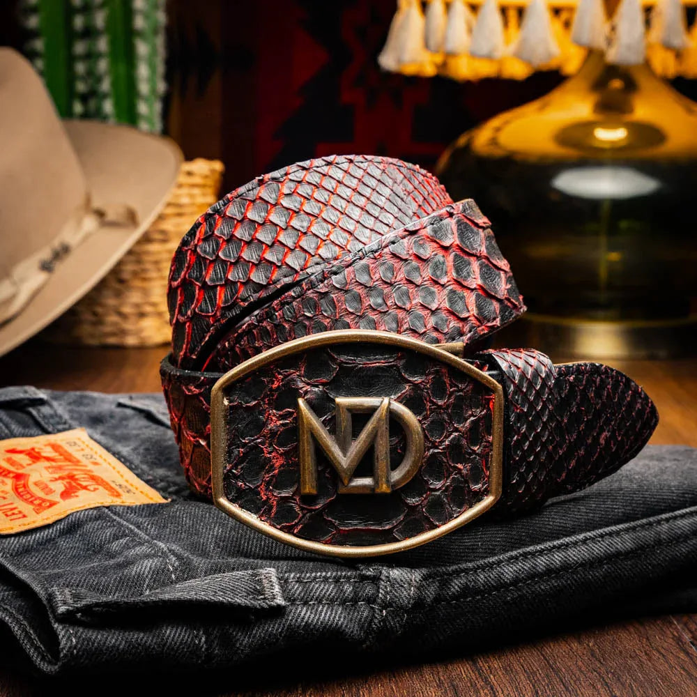 Model wearing Black Cherry Arkansas python skin belt paired with jeans in casual setting.