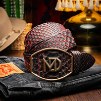 Model wearing Black Cherry Arkansas python skin belt paired with jeans in casual setting.