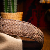 Man dressed in casual shirt and jeans showcasing the brown python belt