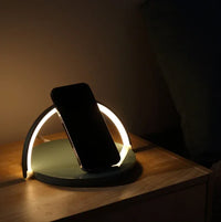 Graphic display of wireless charger block holder with power and charging indicators.
