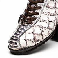 Top view of Batistini sneaker showing silver-tone hardware on tongue and detailed leather textures.