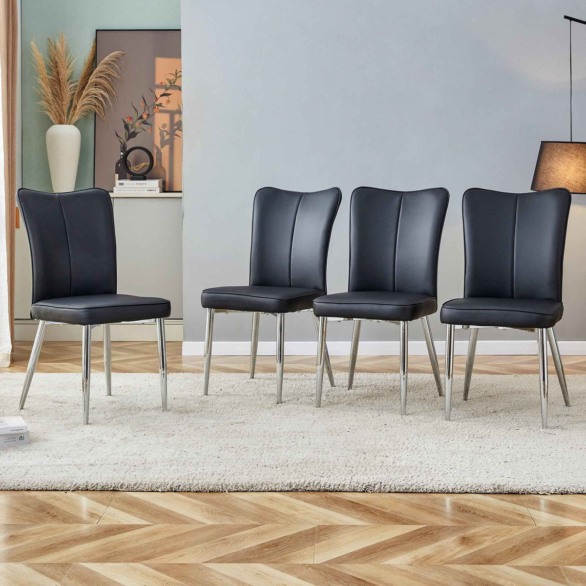 Black modern minimalist dining chair with curved PU leather backrest on metal legs