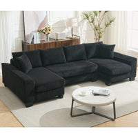 Large black U-shaped sleeper sofa with corduroy upholstery, pull-out bed, and plush seating for four.
