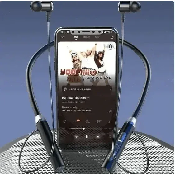 Top view of wireless earphones with magnetic earbuds attached over a plain surface.