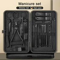 Black manicure nail clipper set with multiple grooming tools neatly arranged in a black case.