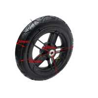 Folding electric scooter wheel with black tire and plastic rim in close-up view.