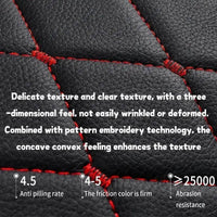 Driver side seat covered with black quilted leather, highlighting padding and fit.