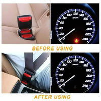 Close-up of the black seat belt extender's red end and silver buckle.