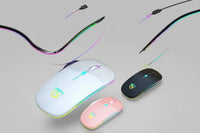 Close-up of black USB rechargeable RGB LED wireless mouse with keyboard in background.