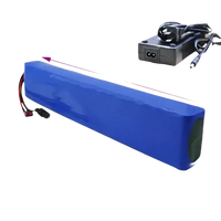 Top-down view of blue 36V 14Ah rechargeable lithium-ion battery for e-bikes with charger.