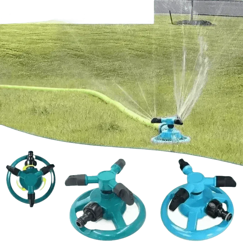 Close-up of blue rotating sprinkler head distributing water droplets over lawn.