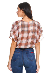 Side angle of plaid blouse highlighting flutter sleeve and tie-front detail.