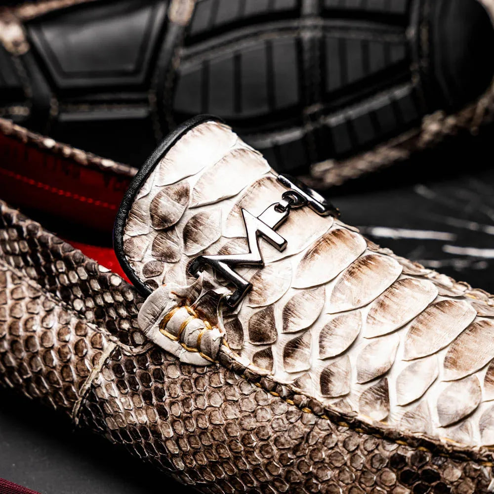 Casual outdoor scene showing the loafers' flexible rubber sole and python skin texture on feet.