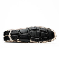 Side angle of genuine python leather driving shoe with flexible sole and distinctive natural pattern.