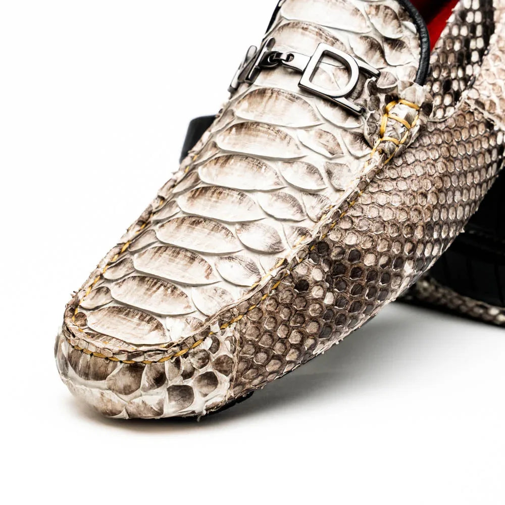 Detail focus on the vamp and side of the python leather loafer showing exotic texture and stitching.