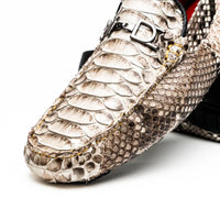 Detail focus on the vamp and side of the python leather loafer showing exotic texture and stitching.