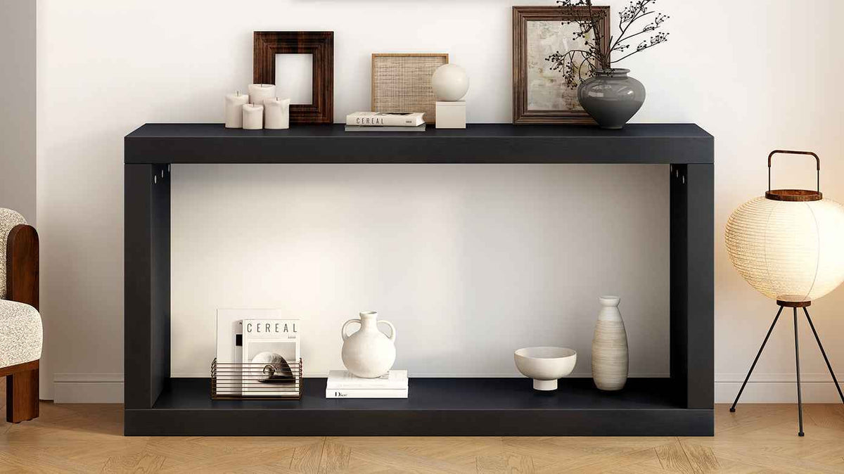 Side view of black minimalist entrance table showing sleek square frame and narrow profile