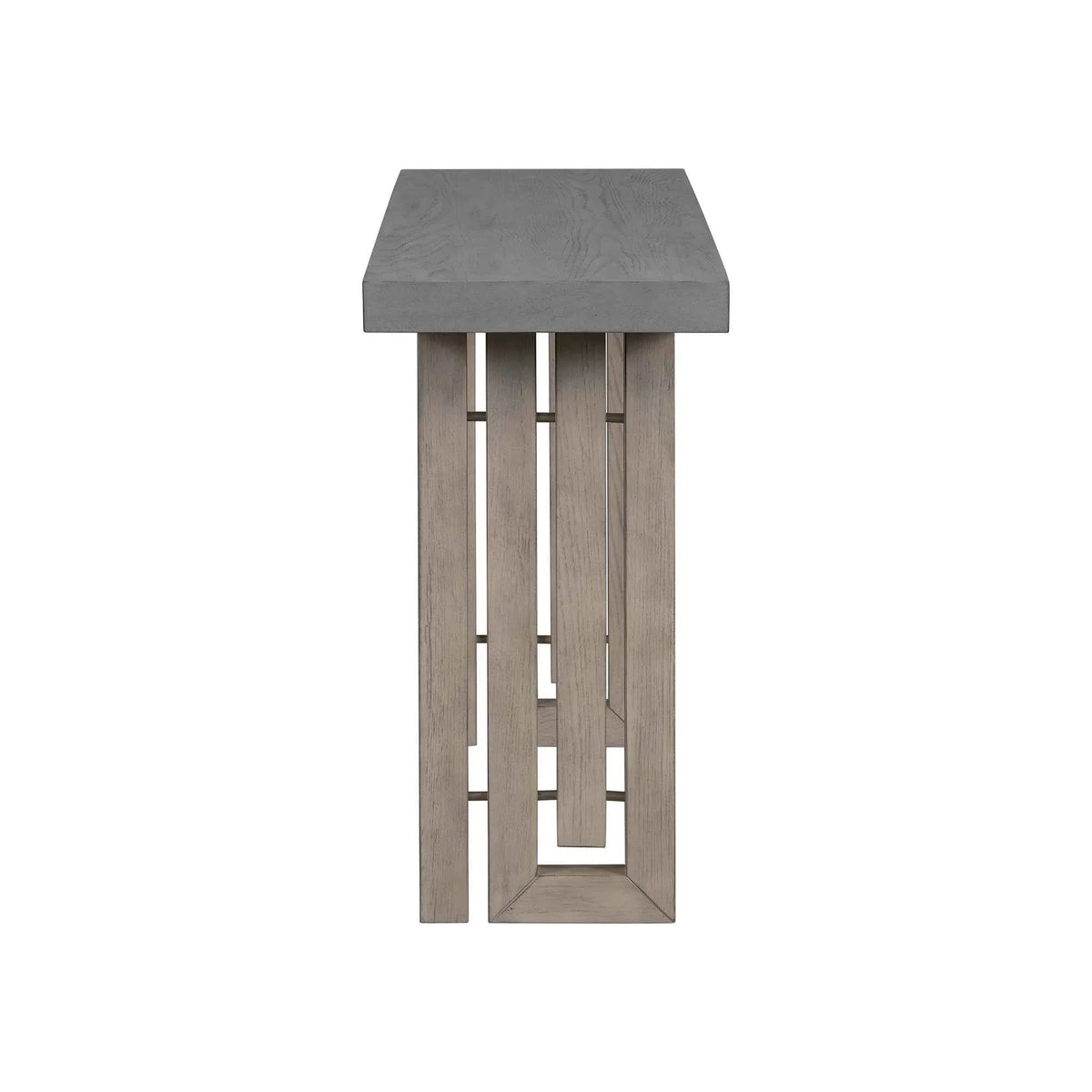 Side view of gray oak veneer console table highlighting artistic carved side panels and slim profile.