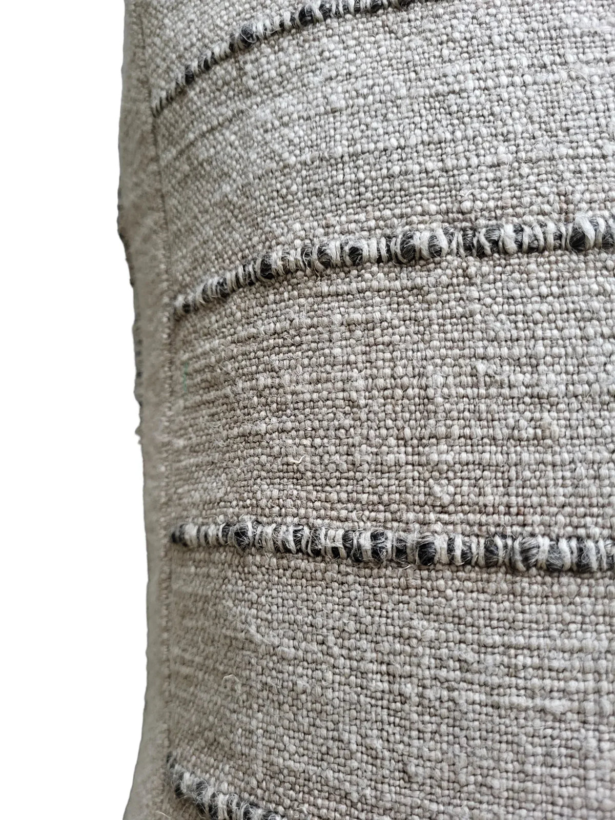Zoomed view of Nomad Floor Cushion's top layer with visible 3D stripes and mixed fabric.