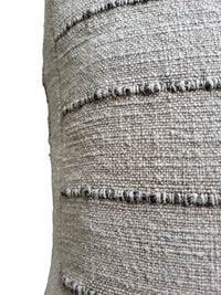 Zoomed view of Nomad Floor Cushion's top layer with visible 3D stripes and mixed fabric.