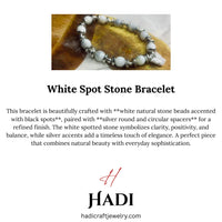 Close-up of Dalmatian Jasper beads with silver spacers showing creamy white stones with black spots