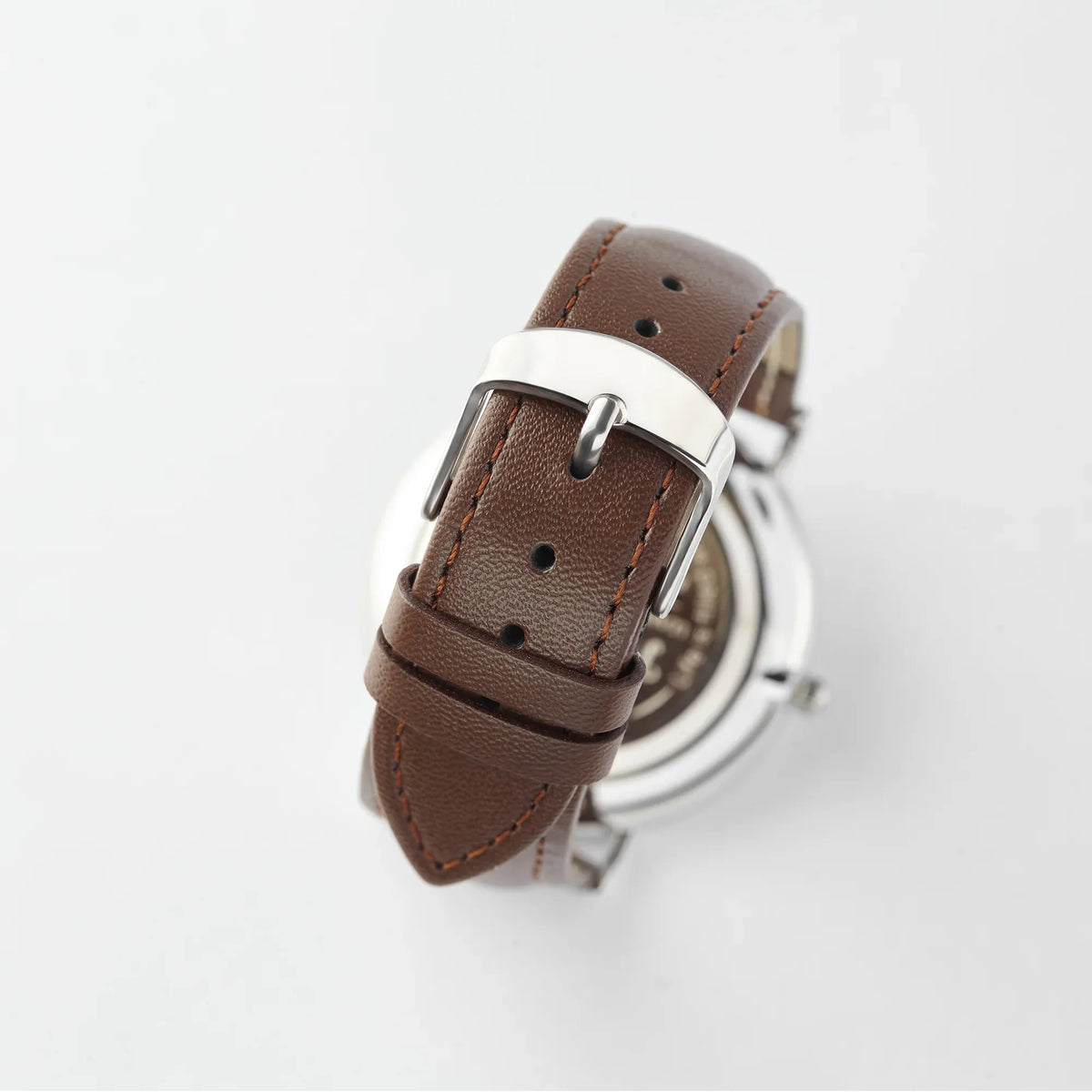 Personalized men's watch worn on wrist showing elegant copper dial and classic design.