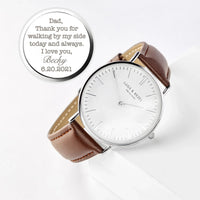 Close-up of personalized men's watch with copper dial and leather band on white background.