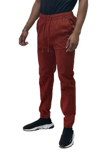 Front view of solid jogger pants with elastic waistband and standard pockets on a plain background.