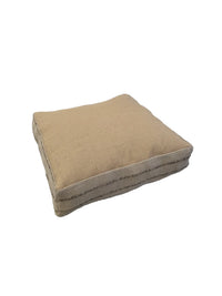 Nomad pouf base side made from natural jute fiber with subtle texture and neutral tones.