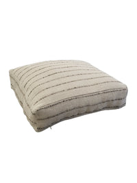 Side close-up of Nomad pouf highlighting textured linen and jute mix and zipper detail.