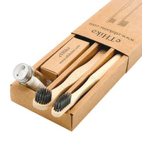 Diagram showing benefits of charcoal bamboo toothbrush, tongue brush, and mint dental floss for oral hygiene.