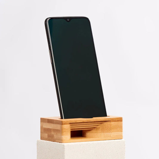 Wooden phone stand shaped like a woodland mouse that also amplifies sound, made of bamboo.