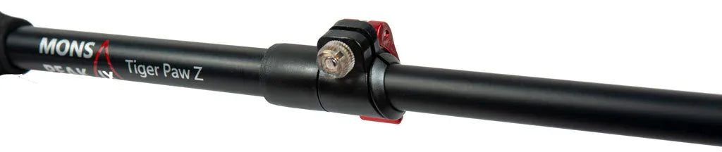 Close-up of trekking pole snap-click compression lock and grip handle in black and cork.