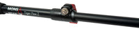 Close-up of trekking pole snap-click compression lock and grip handle in black and cork.