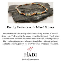 Handmade necklace featuring polished natural agate chip beads in earthy tones on display.