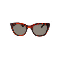 Close-up of the Havana-colored matte black sunglasses lens showing polarized coating.